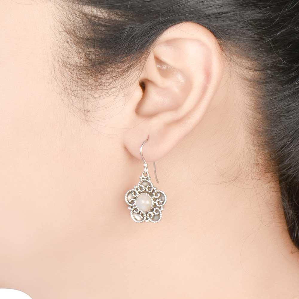 Focus on the moonstone moon motif of these moonstone moon drop earrings.