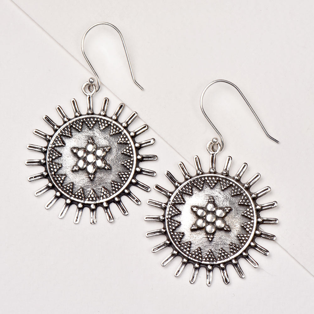 Handmade surya earrings showcasing traditional craft