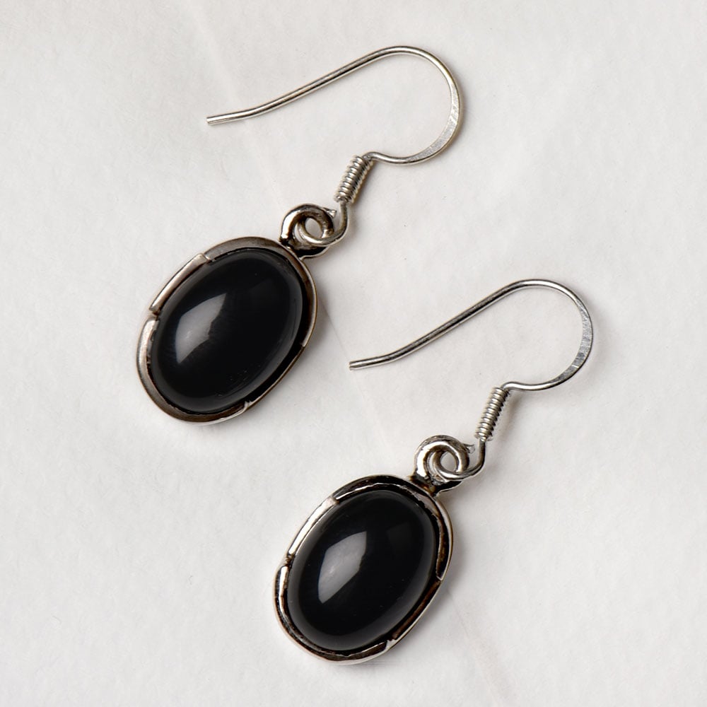 Angled view of Noir Onyx earrings in 92.5 Sterling Silver