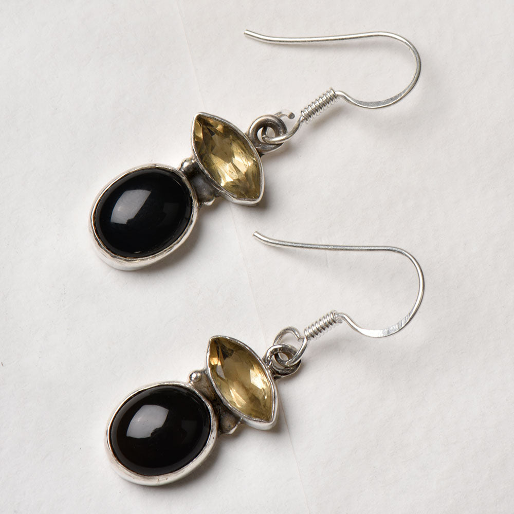 The Citrine & Onyx Round Dangle Earrings displayed with its subtle quiet design and Citrine & Onyx stone