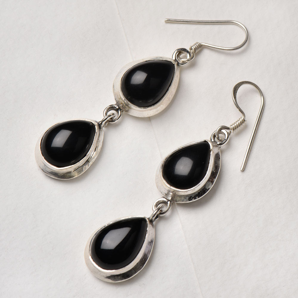 Detail of Black Onyx Oval Dangle Earrings showing the artisanal workmanship and 92.5 Sterling Silver sheen