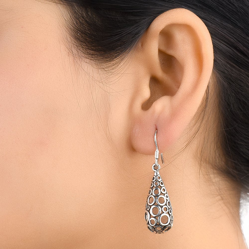 Pair of Polka Filigree earrings with subtle sheen