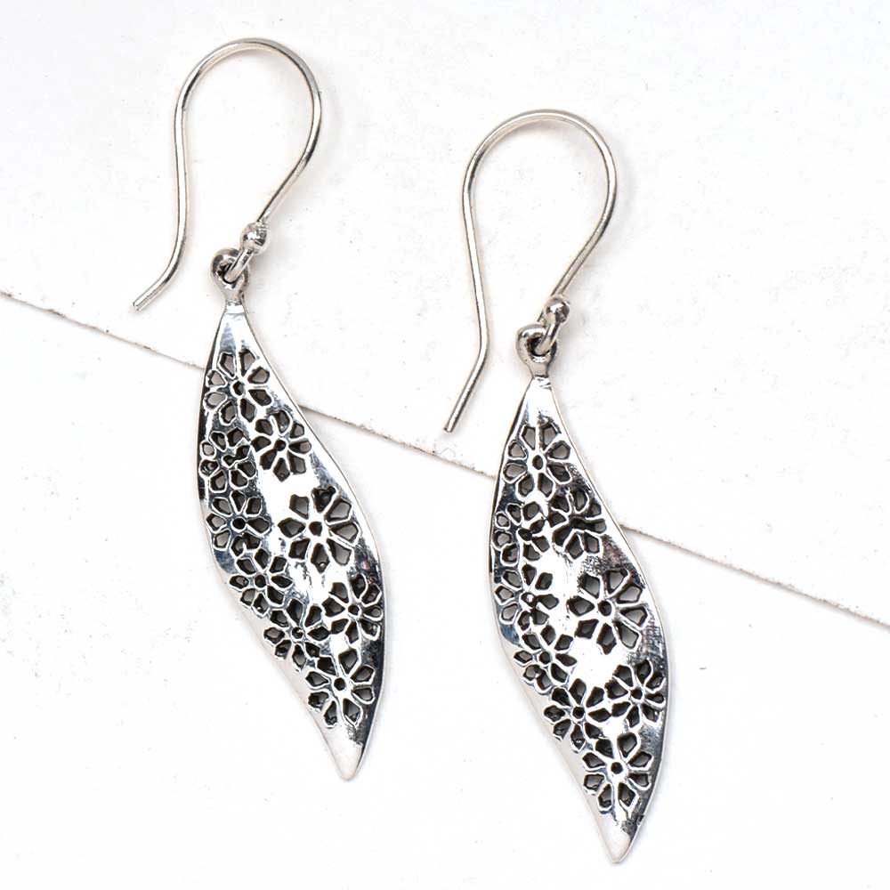 Close-up view of 92.5 sterling silver floral earrings design