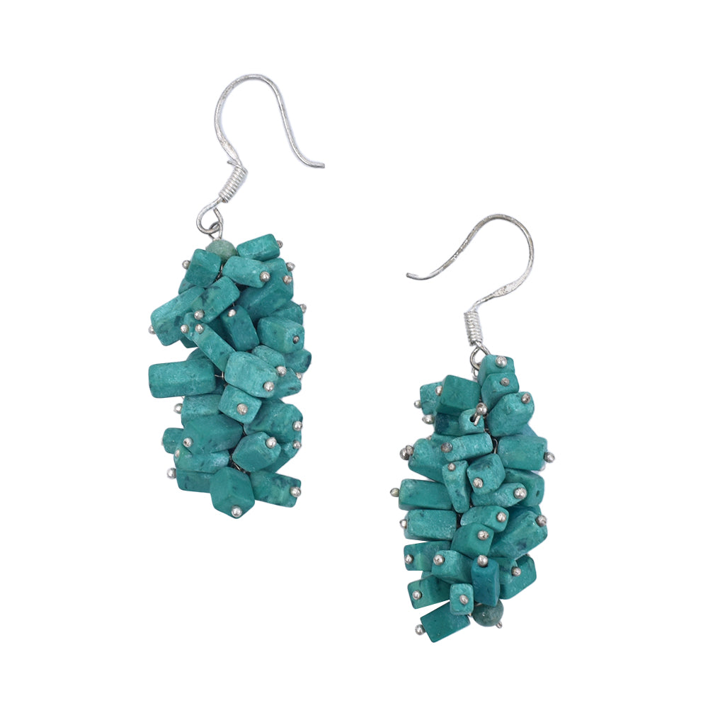 Angled view of Turquoise Drop Earrings showcasing gemstone and 92.5 Sterling Silver.