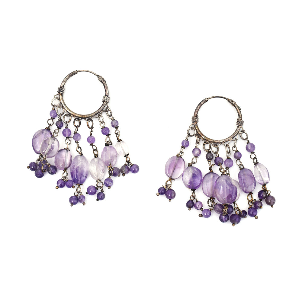 Angled view of Amethyst Earrings showcasing gemstone and 92.5 Sterling Silver.