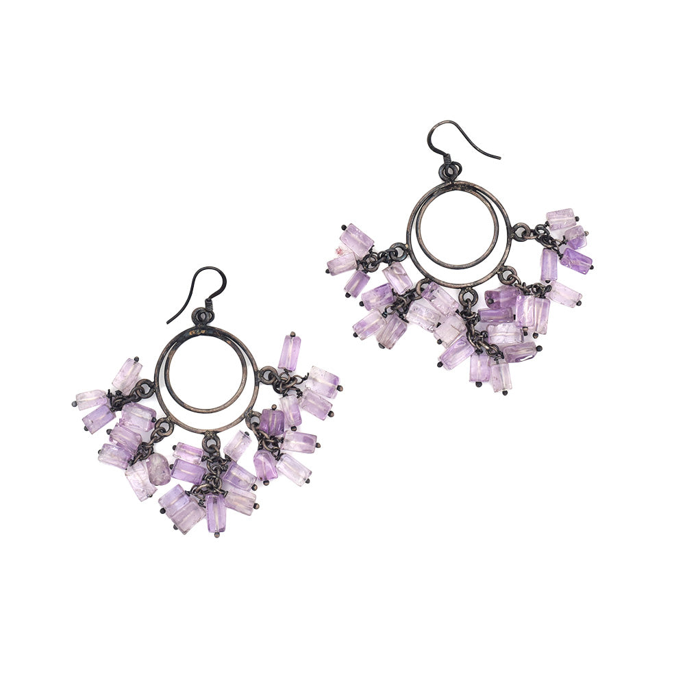 Pair of charming light purple earrings laid flat, displaying handcrafted craftsmanship in 92.5 Sterling Silver.