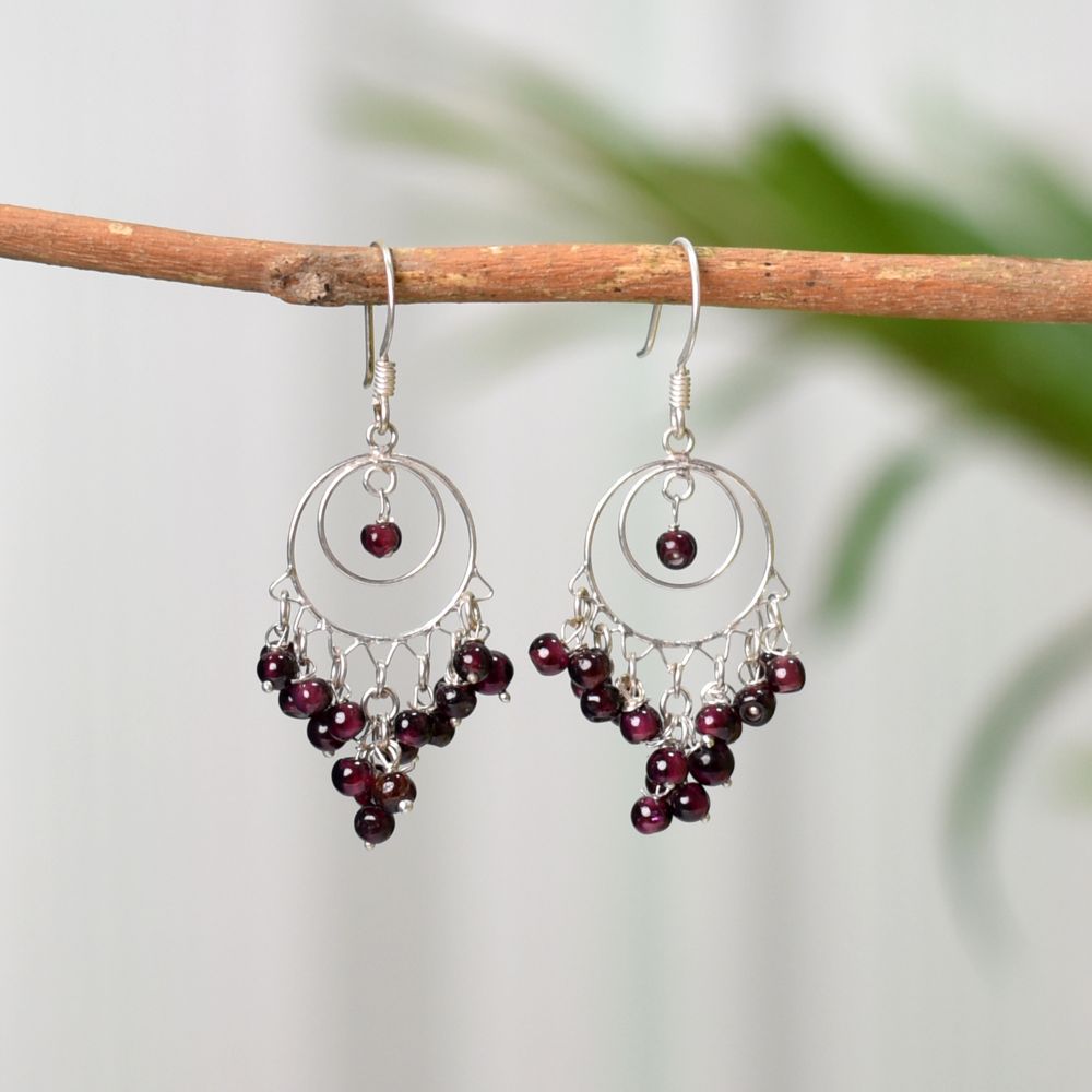 Close-up of intricate details on these 92.5 Sterling Silver garnet round earrings.