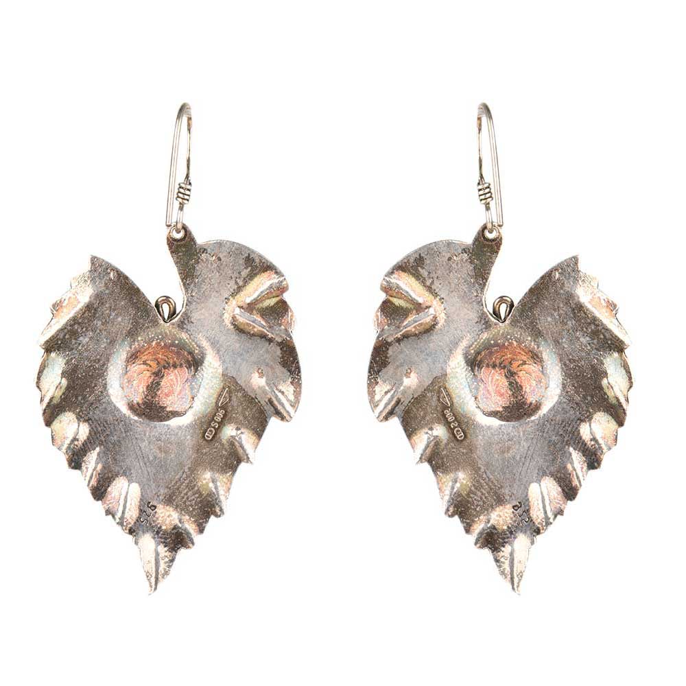 Close up of handmade leaf dangle earrings in 92.5 Sterling Silver