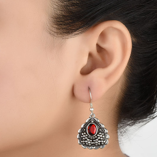 Front view of Dil heart red stone dangle earrings crafted in 92.5 Sterling Silver.
