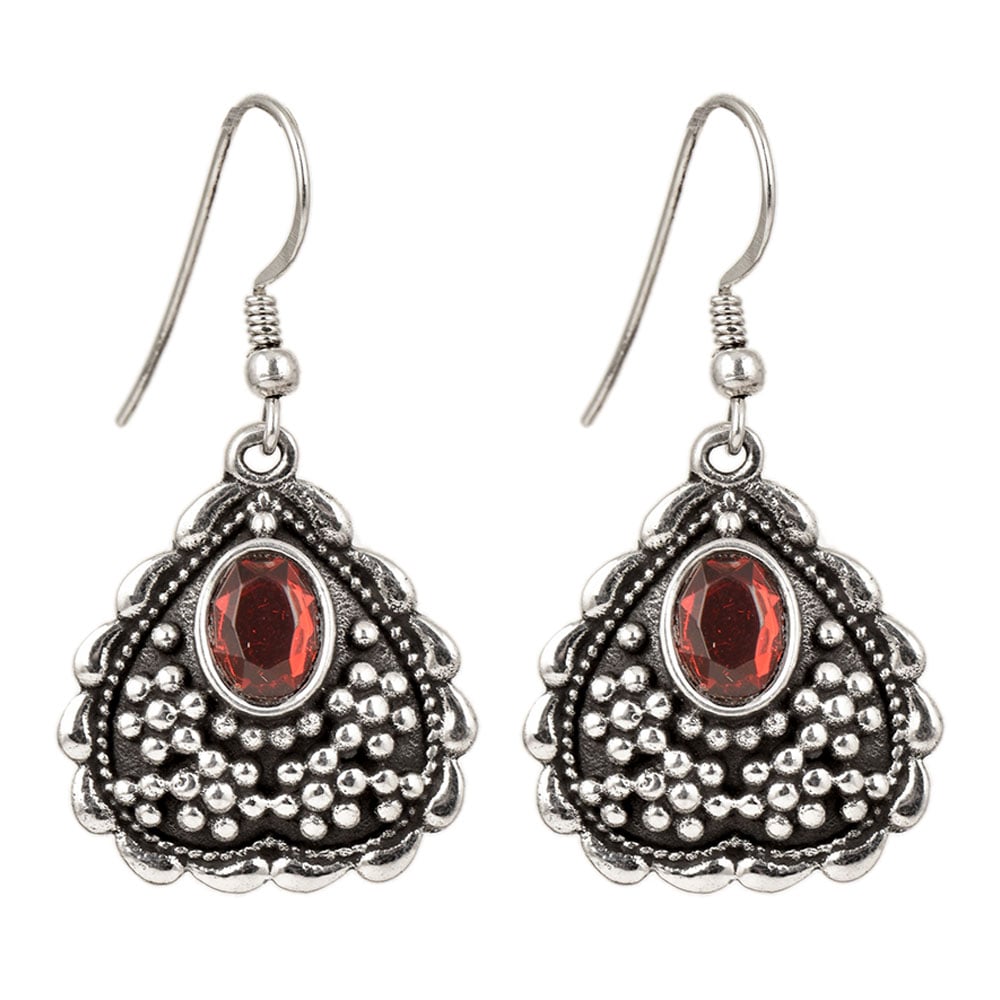 Close-up of intricate details on these 92.5 Sterling Silver heart red stone dangle earrings.