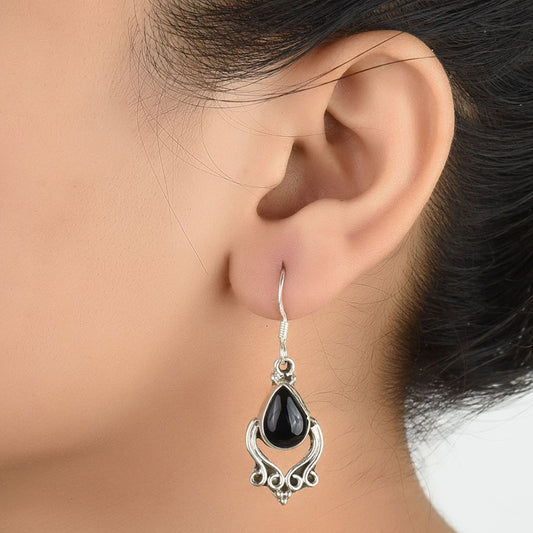 Front view of Reet simple black stone dangle earrings crafted in 92.5 Sterling Silver.