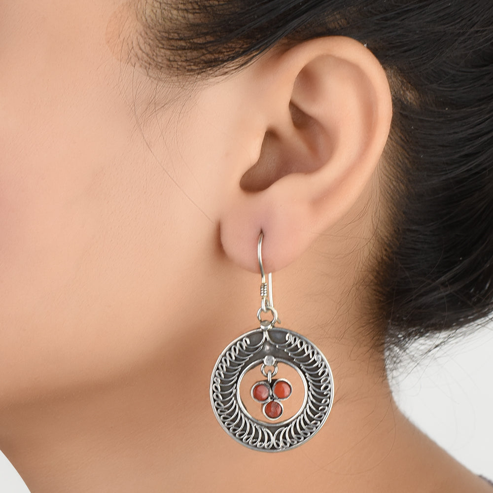 Front view of Reet jasper engraved circle earrings crafted in 92.5 Sterling Silver.