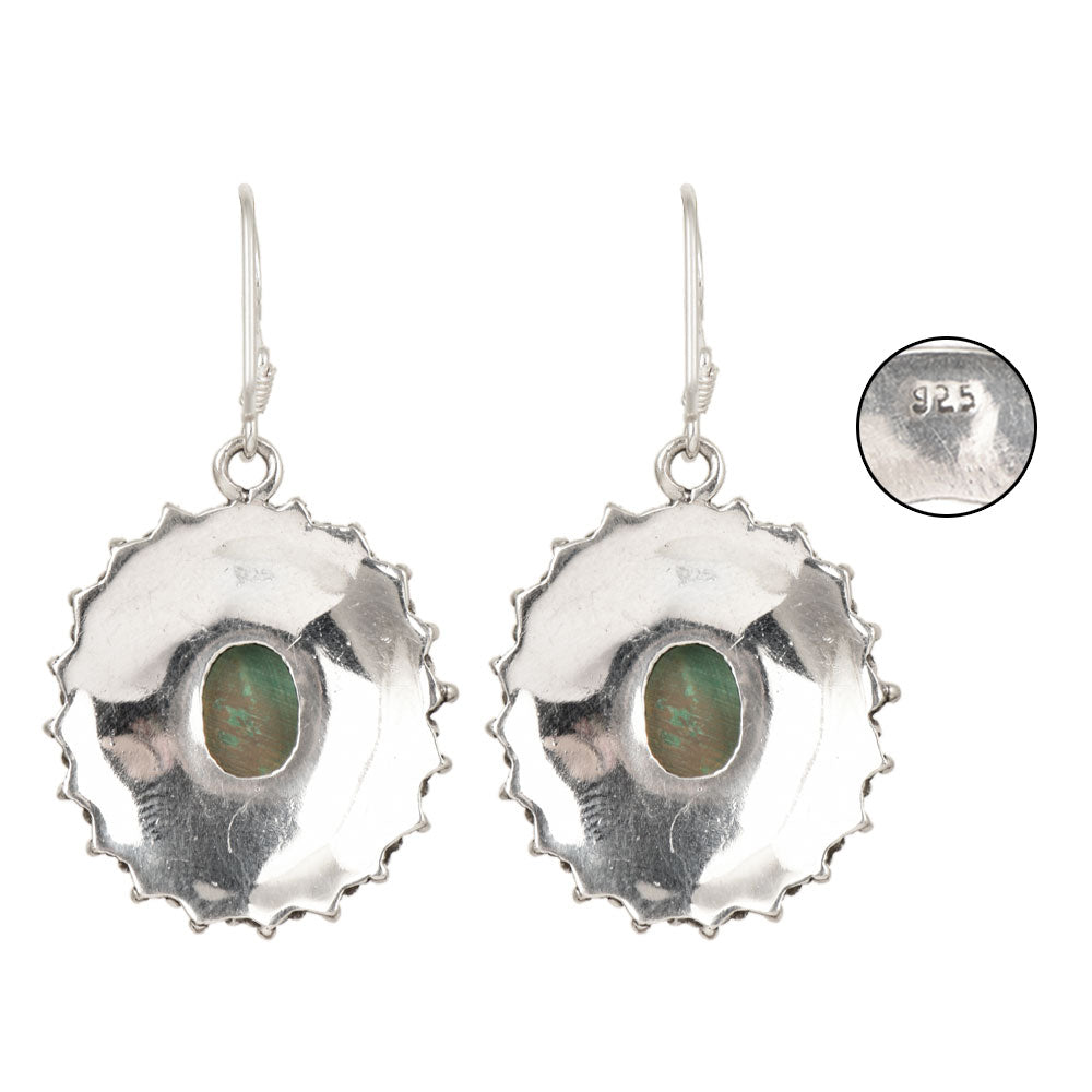 Side angle showing malachite drop earrings with silver , green tones.