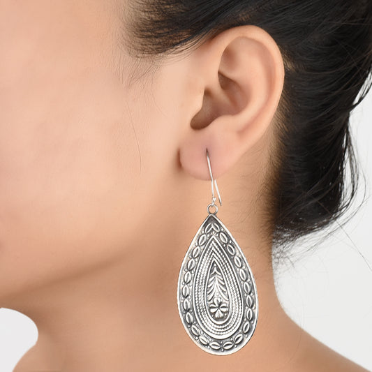 Front view of Banjara tribala dangle statement dangle earrings crafted in 92.5 Sterling Silver.