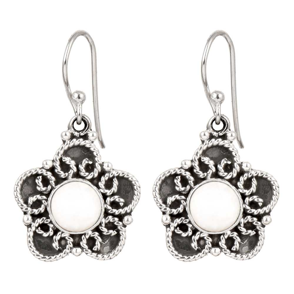 Side angle showing moonstone moon drop earrings with silver tones.