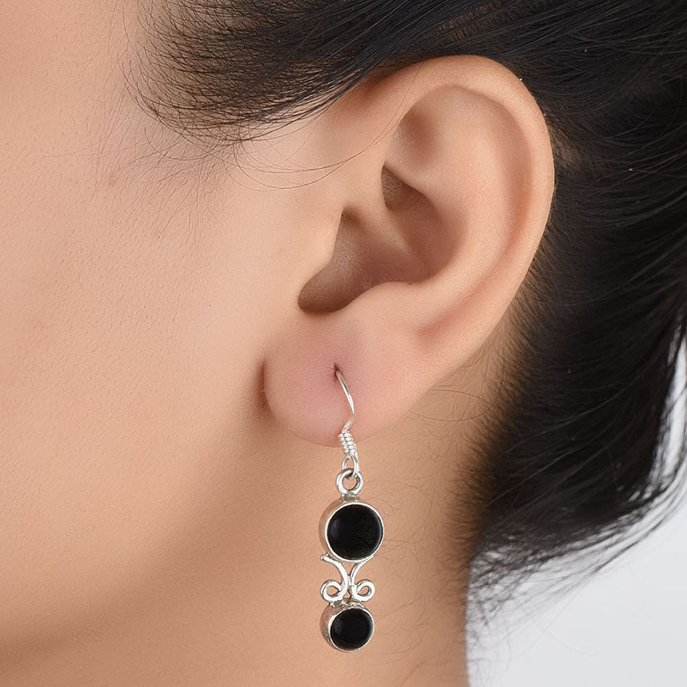 Front view of Noir Onyx black onyx drop earrings crafted in 92.5 Sterling Silver.