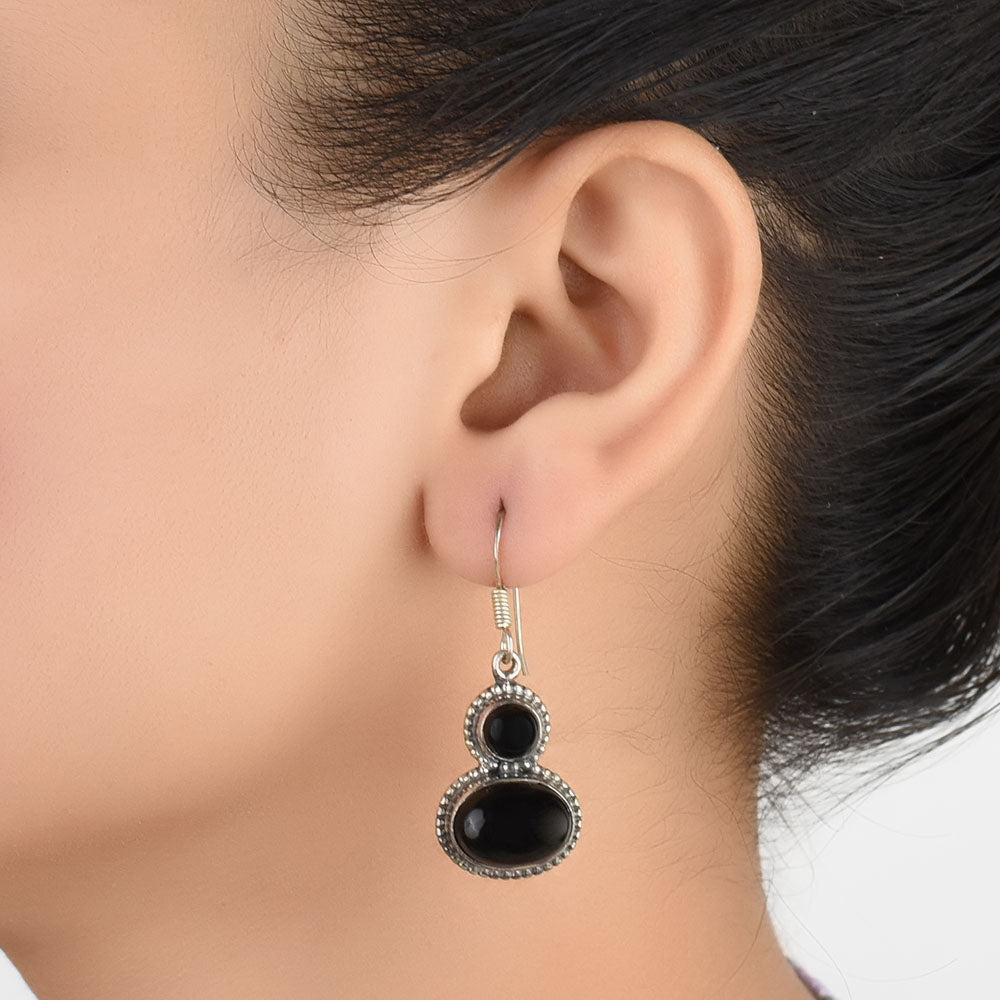 Front view of Noir Onyx onyx dangle earrings crafted in 92.5 Sterling Silver.
