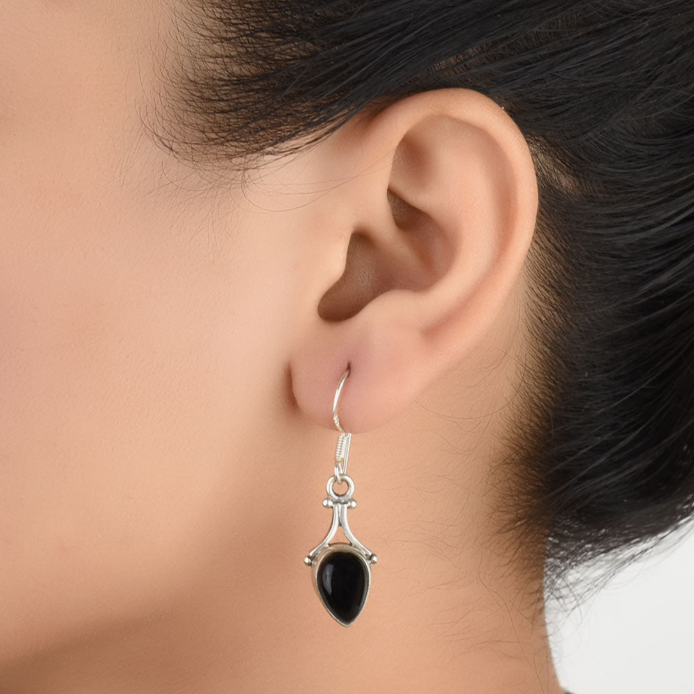 Front view of Noir Onyx onyx teardrop drop earrings crafted in 92.5 Sterling Silver.