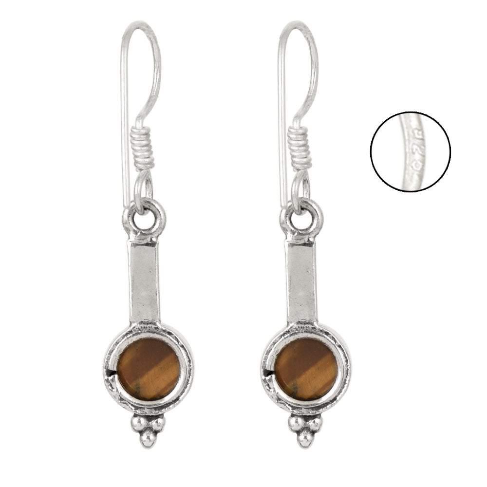 Side angle showing pure ball design dangle earrings with silver tones.