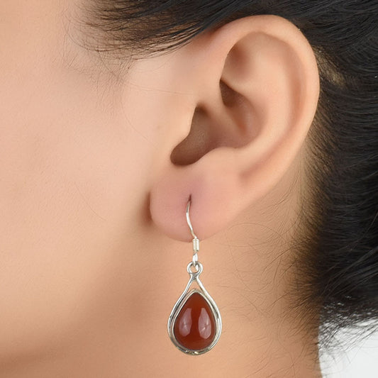 Front view of Reet red jasper raindrop stud earrings crafted in 92.5 Sterling Silver.