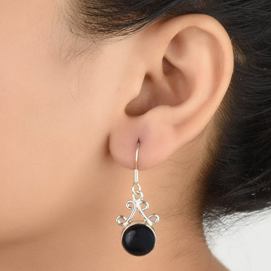 Front view of Noir Onyx black onyx dangle earrings crafted in 92.5 Sterling Silver.