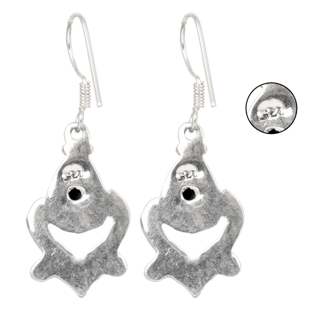 Close-up of intricate details on these 92.5 Sterling Silver turquoise dangle earrings.