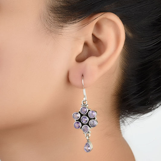 Model wearing Amethyst Dangle Earrings, highlighting size and 92.5 Sterling Silver.