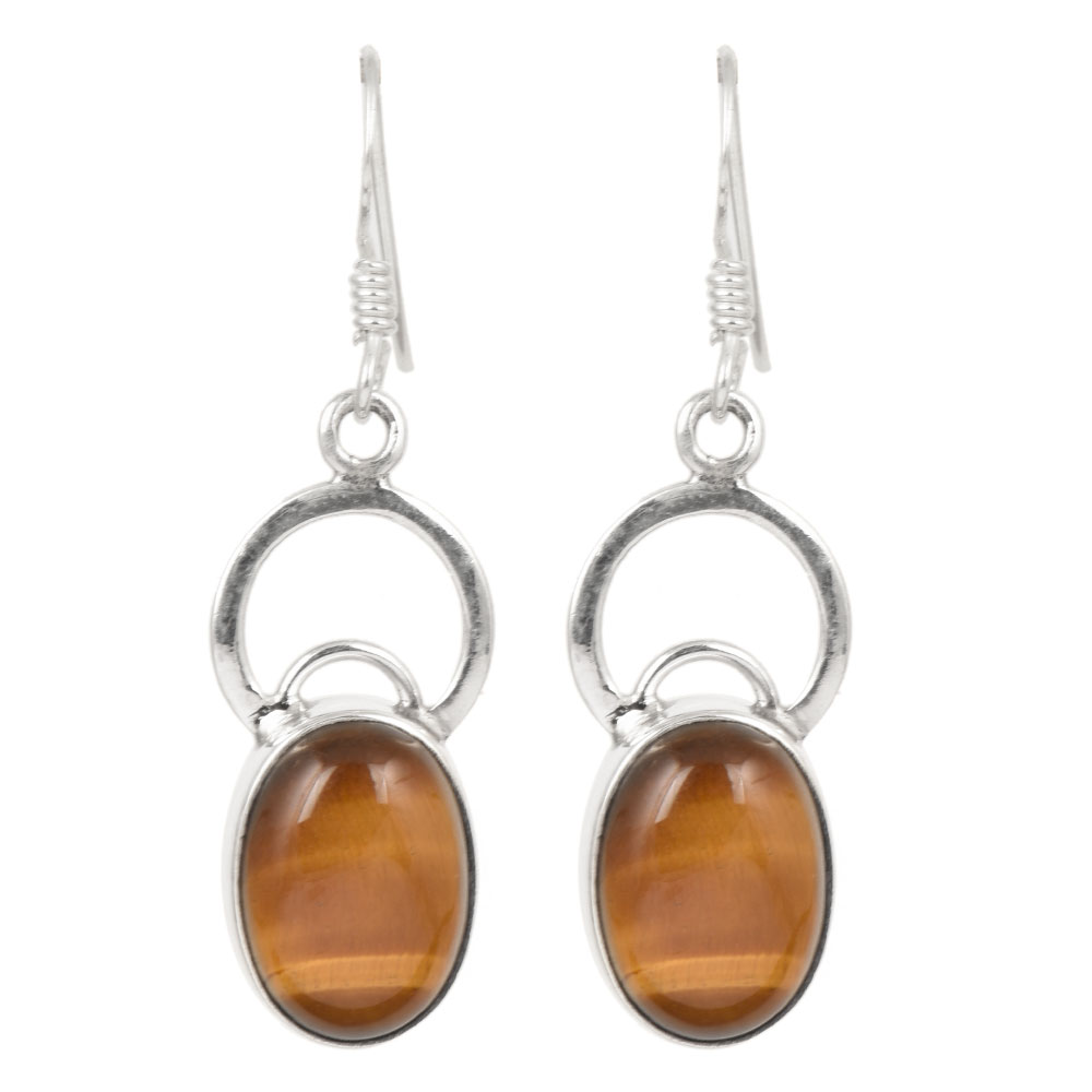 Side angle showing casual wear tiger drop earrings with silver , brown tones.