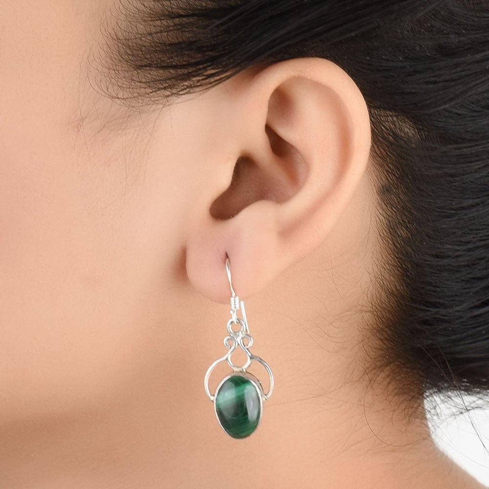 Close-up of the intricate design on Oval Dangle Earrings with Silver and Green accents in 92.5 Sterling Silver.