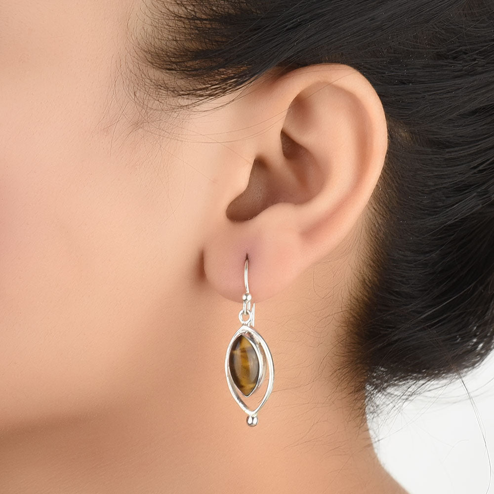 Earrings with tigers eye in 92.5 Sterling Silver, handcrafted and inspired by godna tattoos.