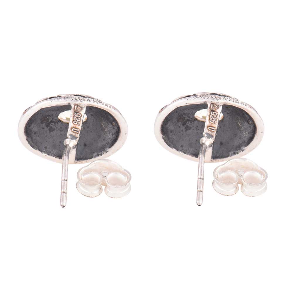 Close-up of enamel stone fashion set in 92.5 Sterling Silver stud earrings.