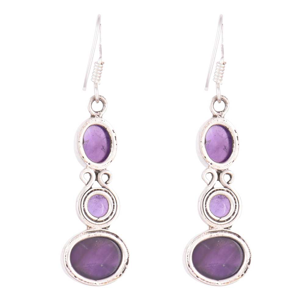 Close-up of amethyst set in 92.5 Sterling Silver dangle earrings.