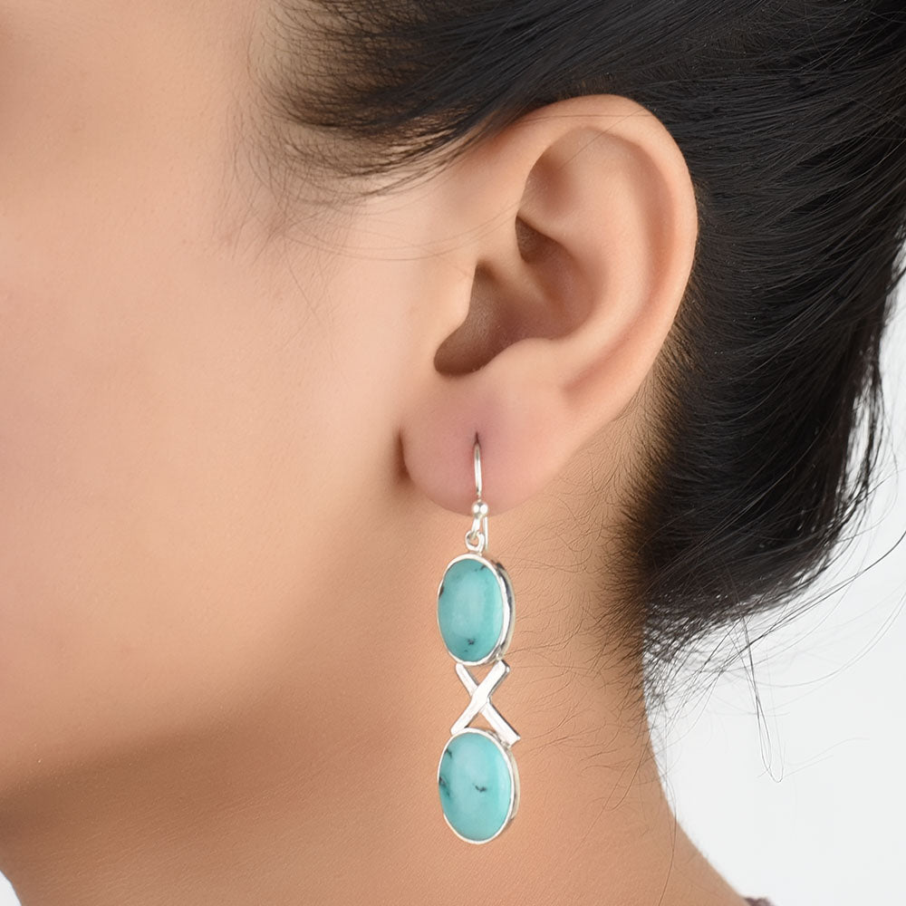 Close-up of the intricate design on Turquoise Dangle Earrings with Silver and Turquoise accents in 92.5 Sterling Silver.
