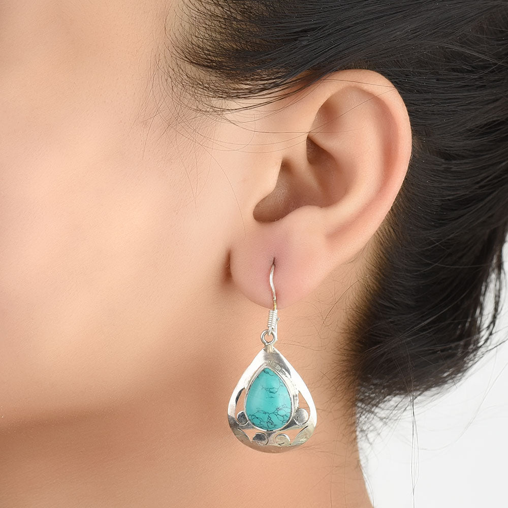 Close-up of the intricate design on Turquoise Oval Earrings with Silver and Turquoise accents in 92.5 Sterling Silver.