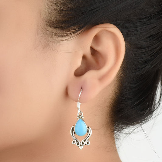 Close-up of the intricate design on Turquoise Earrings with Silver and Turquoise accents in 92.5 Sterling Silver.