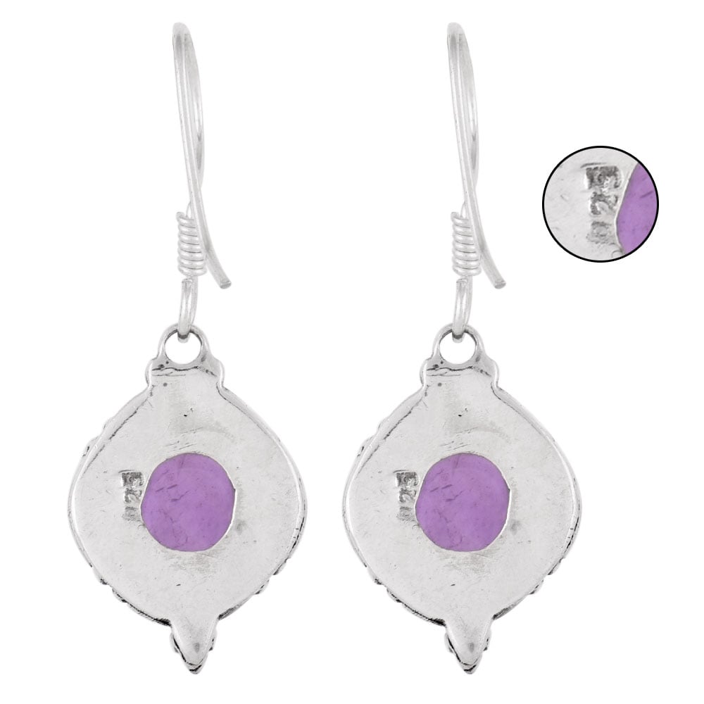 Close-up of amethyst set in 92.5 Sterling Silver round earrings.
