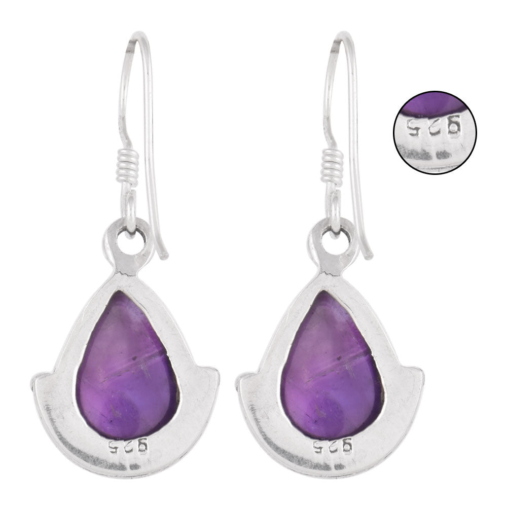 Close-up of amethyst set in 92.5 Sterling Silver dangle earrings.