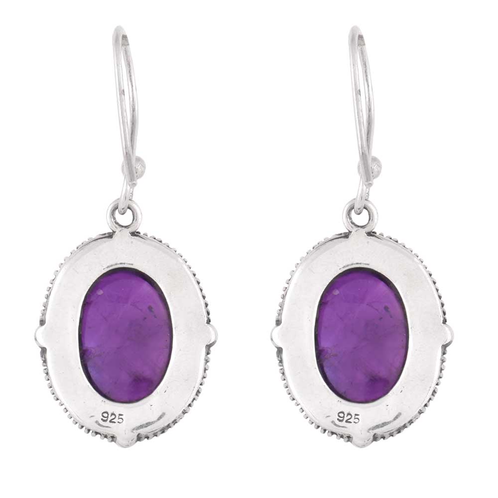 Close-up of amethyst set in 92.5 Sterling Silver oval earrings.