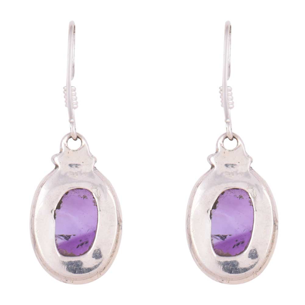 Close-up of amethyst set in 92.5 Sterling Silver oval earrings.