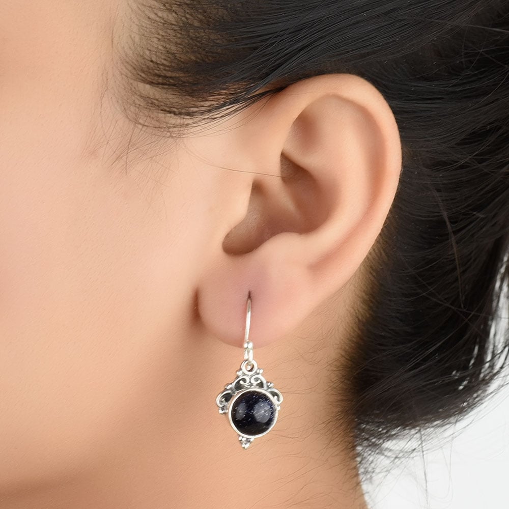 Wire earrings with blue goldstone in 92.5 Sterling Silver, patiently handmade and inspired by folk embroidery.