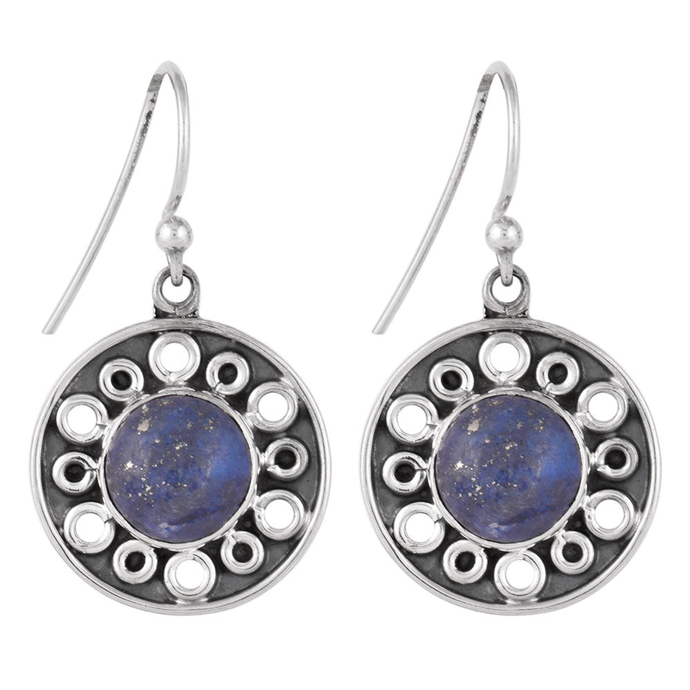 Gul Lapis dangle earrings resting on fabric, showing lapis floral and subtle handwork.