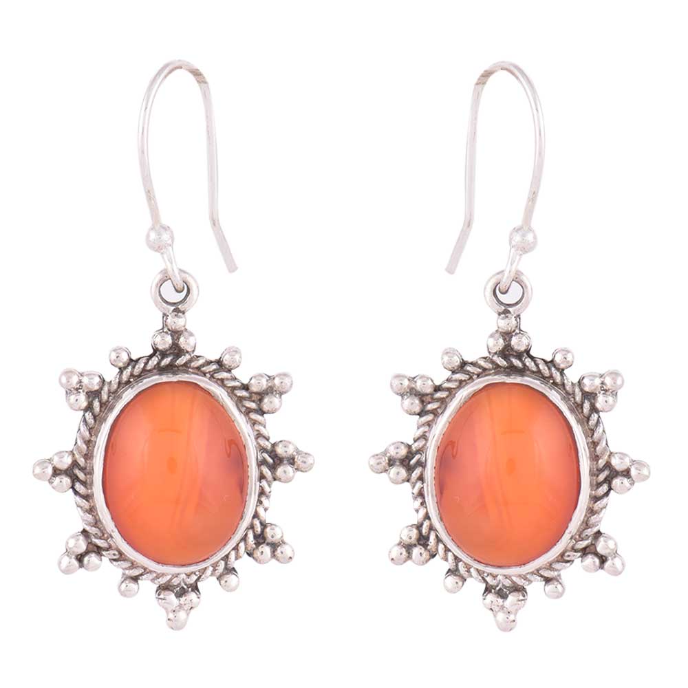 Sitara Carnelian earrings resting on fabric, showing carnelian and subtle handwork.