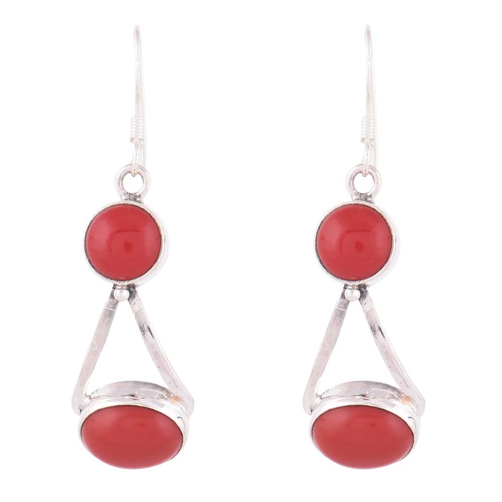 Agate dangle earrings resting on fabric, showing agate and subtle handwork.