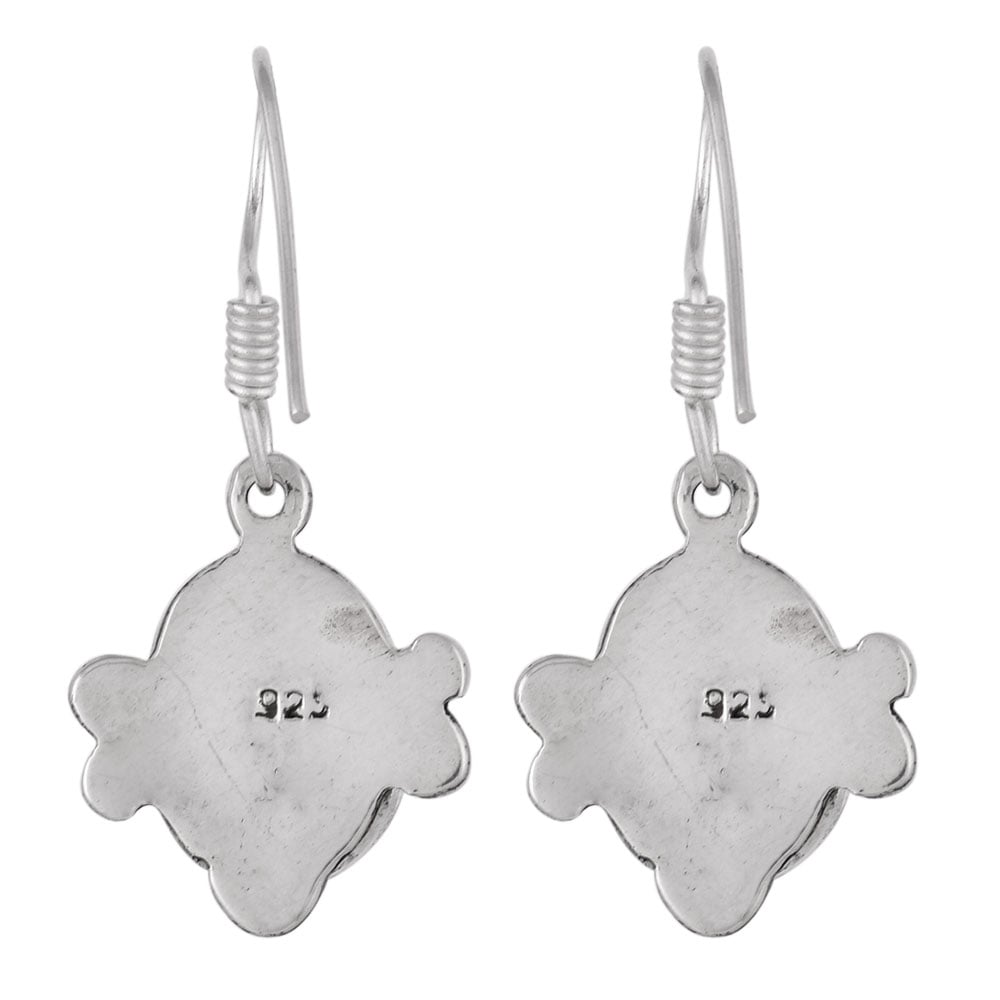 Close up of Classic Green Corundum stone set in sterling silver earrings