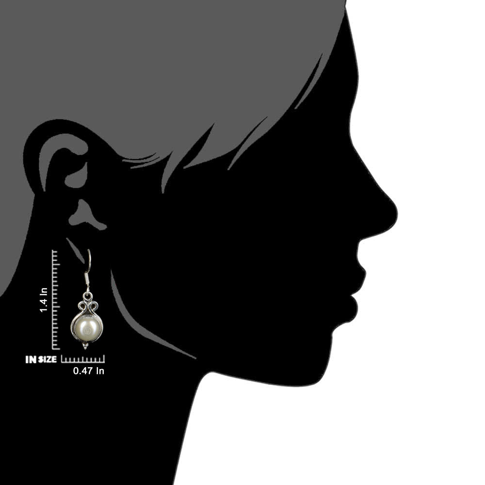 Side view of the artisan made Moonstone Moon Earrings revealing the texture and light play