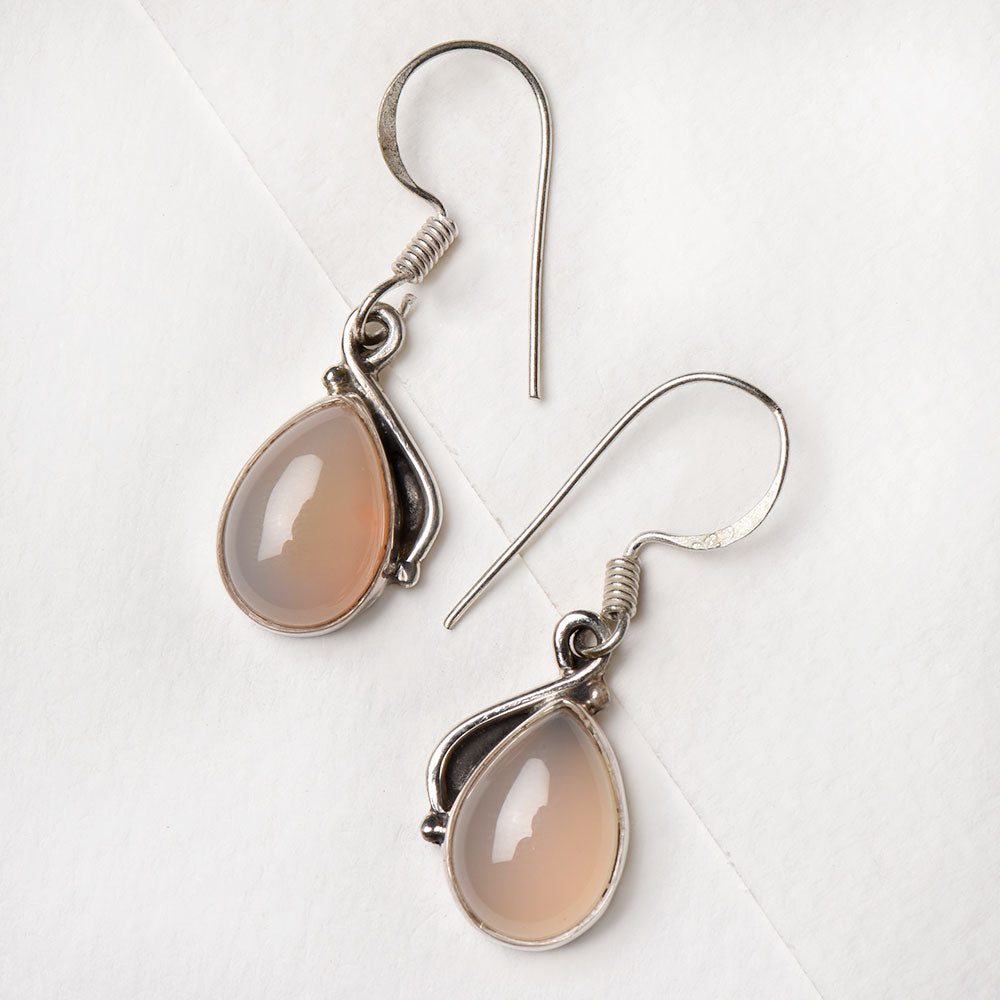 Closeup of Moonstone Moon Dangle Earrings showcasing the detailed dangle motif and 92.5 Sterling Silver finish