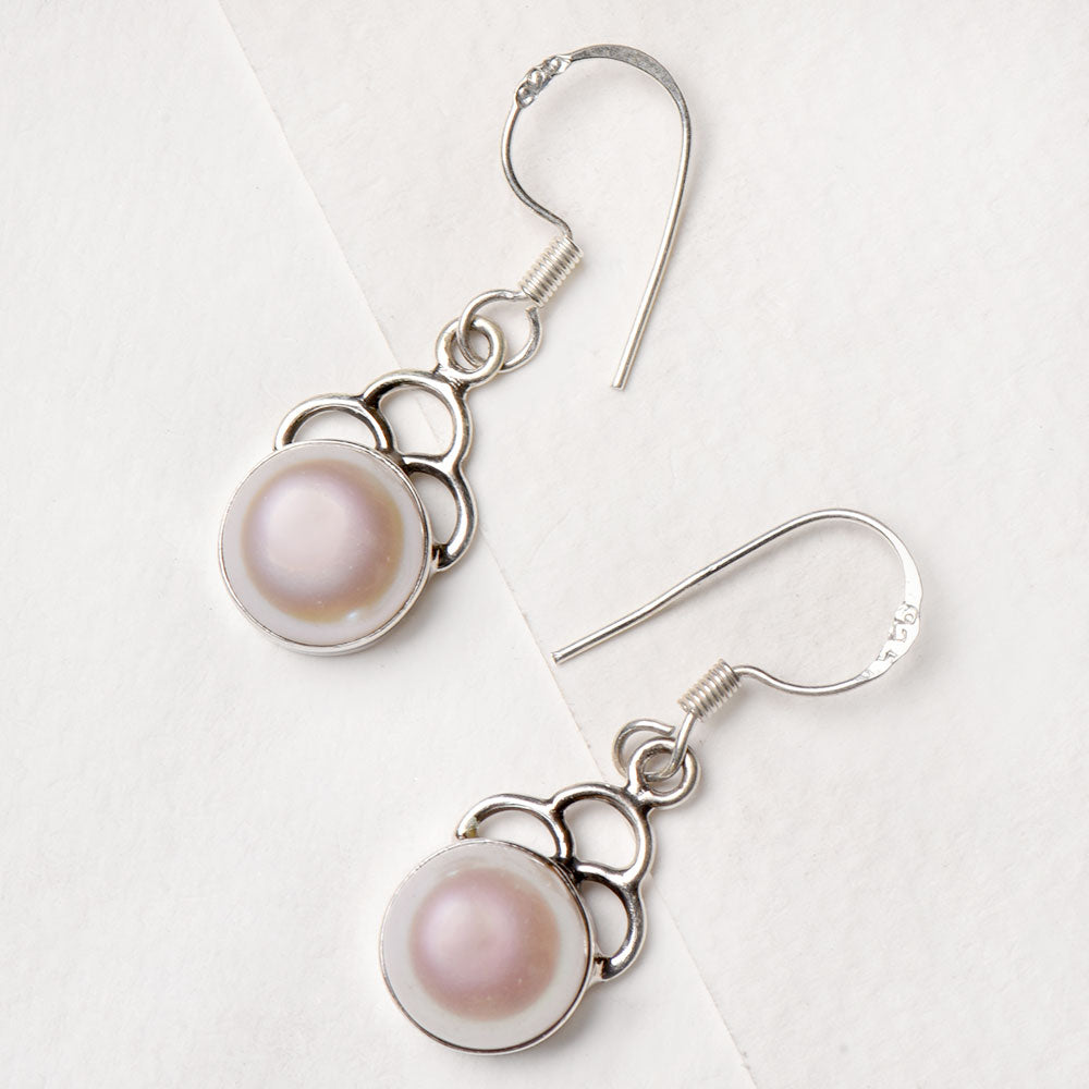 Closeup of Quartz Round Dangle Earrings showcasing the detailed round motif and 92.5 Sterling Silver finish