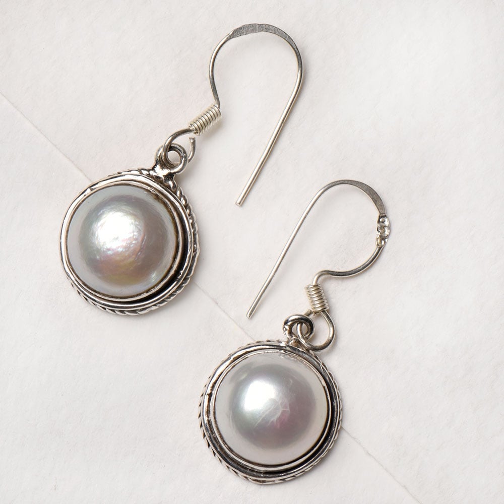 Closeup of Peals Studded Hook Stud Earrings showcasing the detailed earrings motif and 92.5 Sterling Silver finish