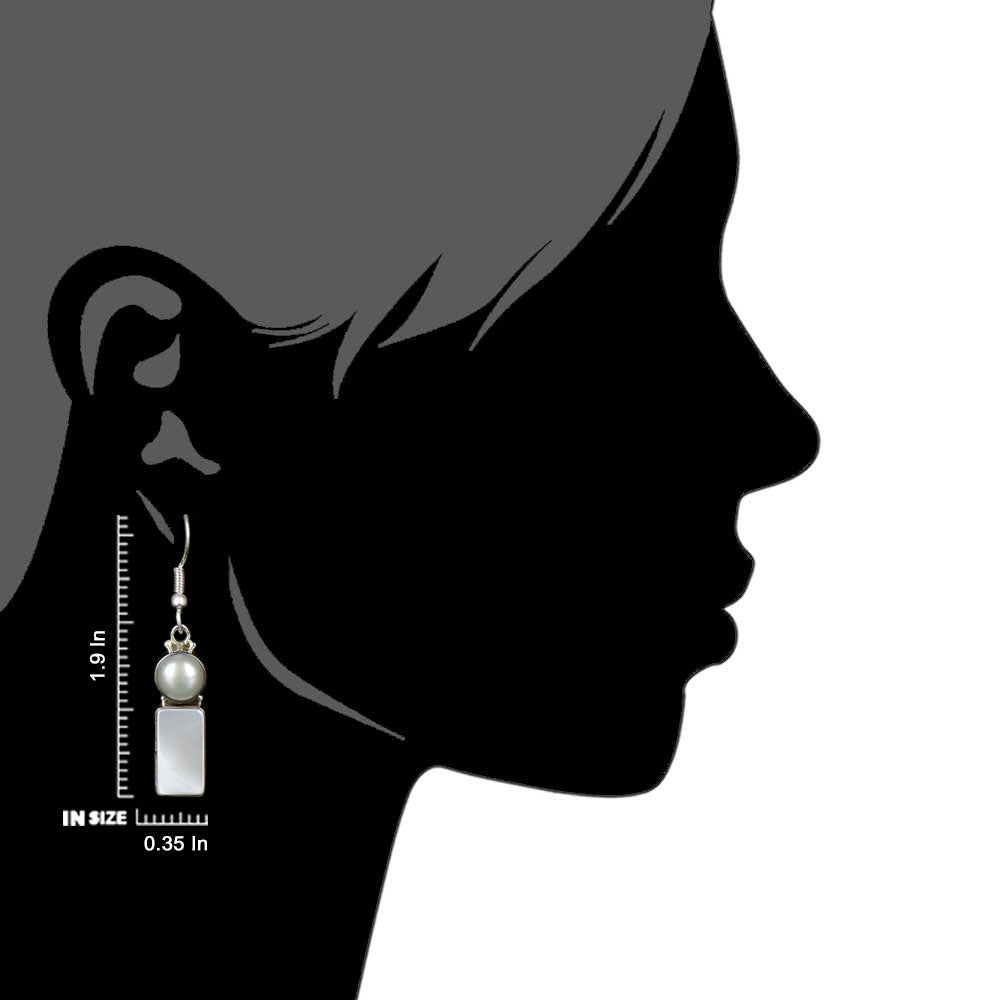 Side view of the artisan made Moonstone Moon Dangle Earrings revealing the texture and light play