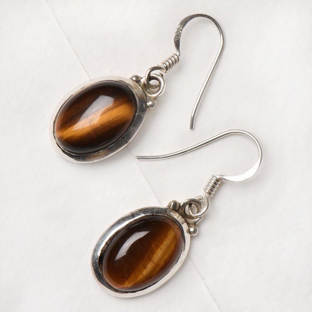 Closeup of Oval Earrings showcasing the detailed oval motif and 92.5 Sterling Silver finish